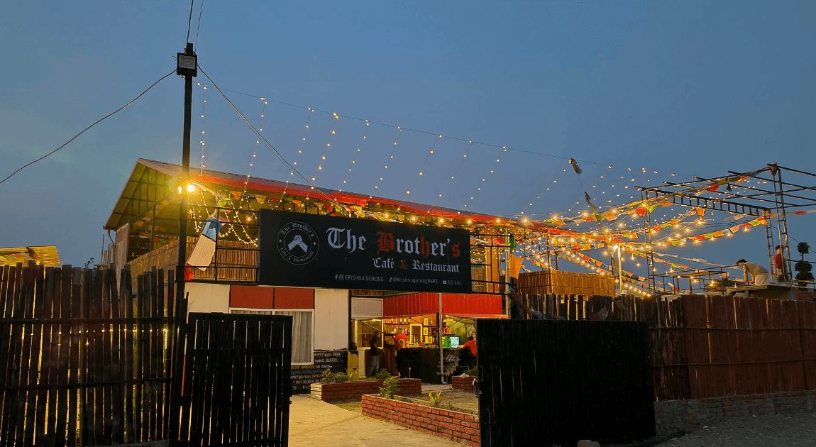 The Brother's Café & Restaurant storefront at night, running on the Brother POS system built by AayamX